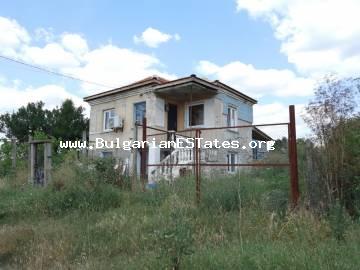 A partially renovated house with a large courtyard and a beautiful view is for sale in the village of Zagortsi, just 40 km from the city of Burgas and the sea, 10 km from the city of Sredets, Bulgaria.