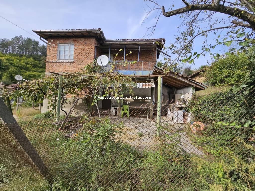 For sale is a massive two-storey house in the Strandzha Mountains, the village of Kosti, only 22 km from the town of Tsarevo and the sea, 40 km from the checkpoint with the Republic of Turkey, and 85 km from the town of Tsarevo, Burgas, Bulgaria.